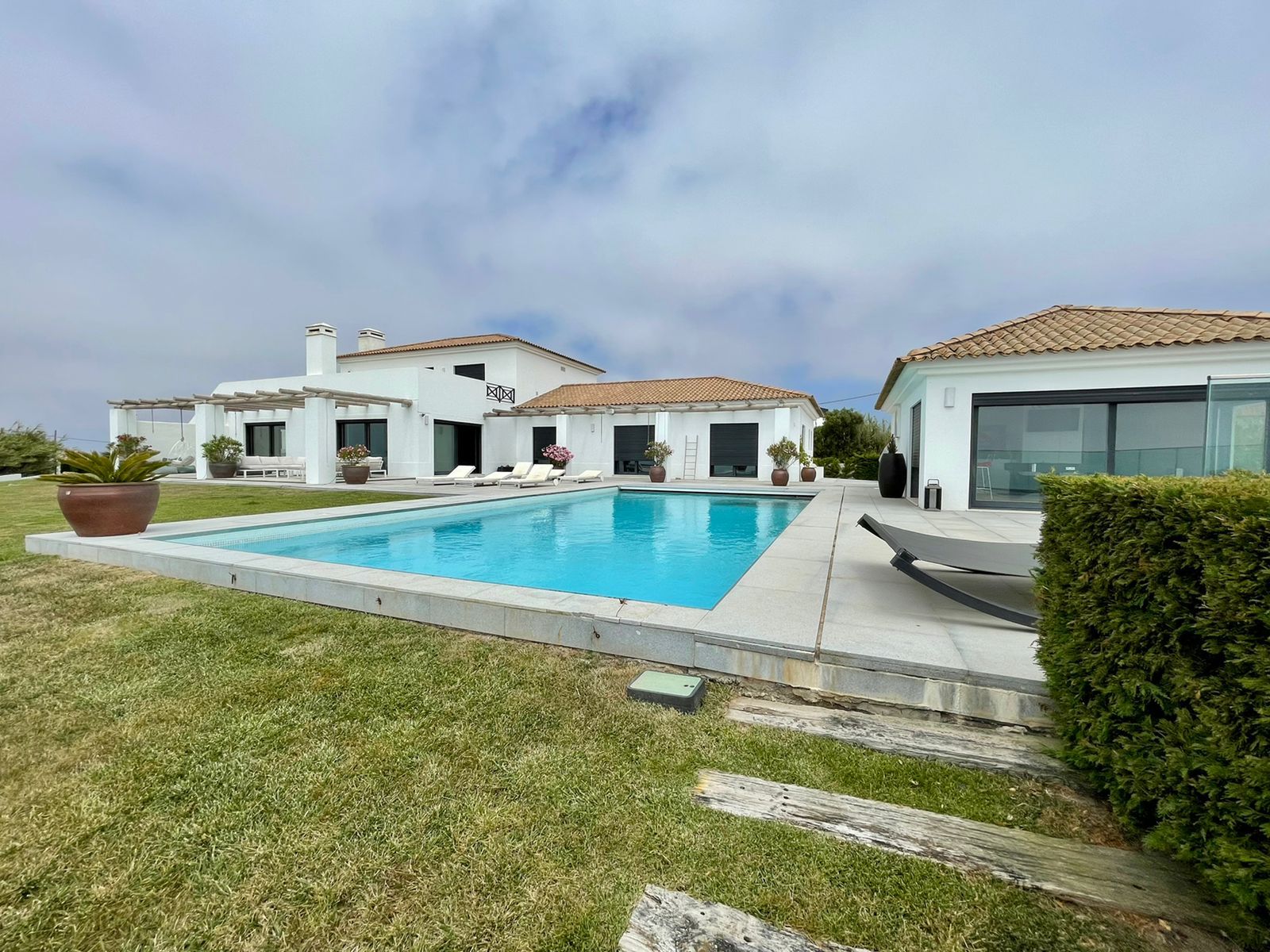 The pool and house